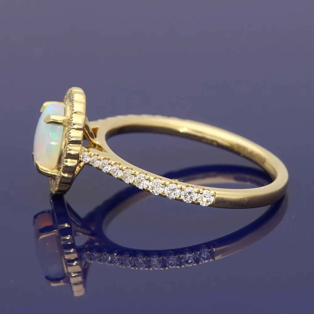 18ct Yellow Gold Oval Opal and Diamond Halo Ring